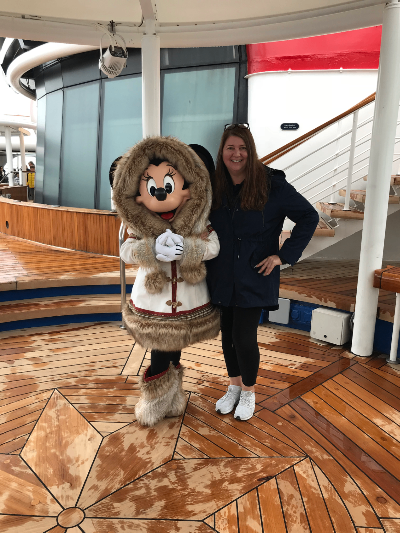Sandra with Minnie Mouse on deck during a Disney Alaska cruise